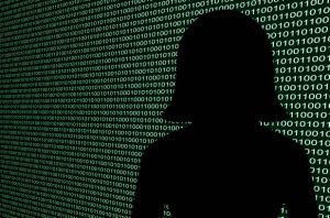 Silhouette of a woman in front of digital data